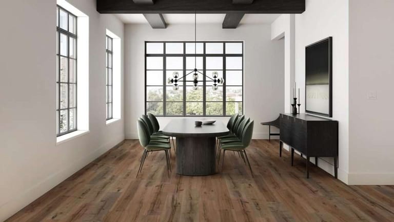 Weathered brown wood plank flooring in a dining room with black-framed windows and green chairs.