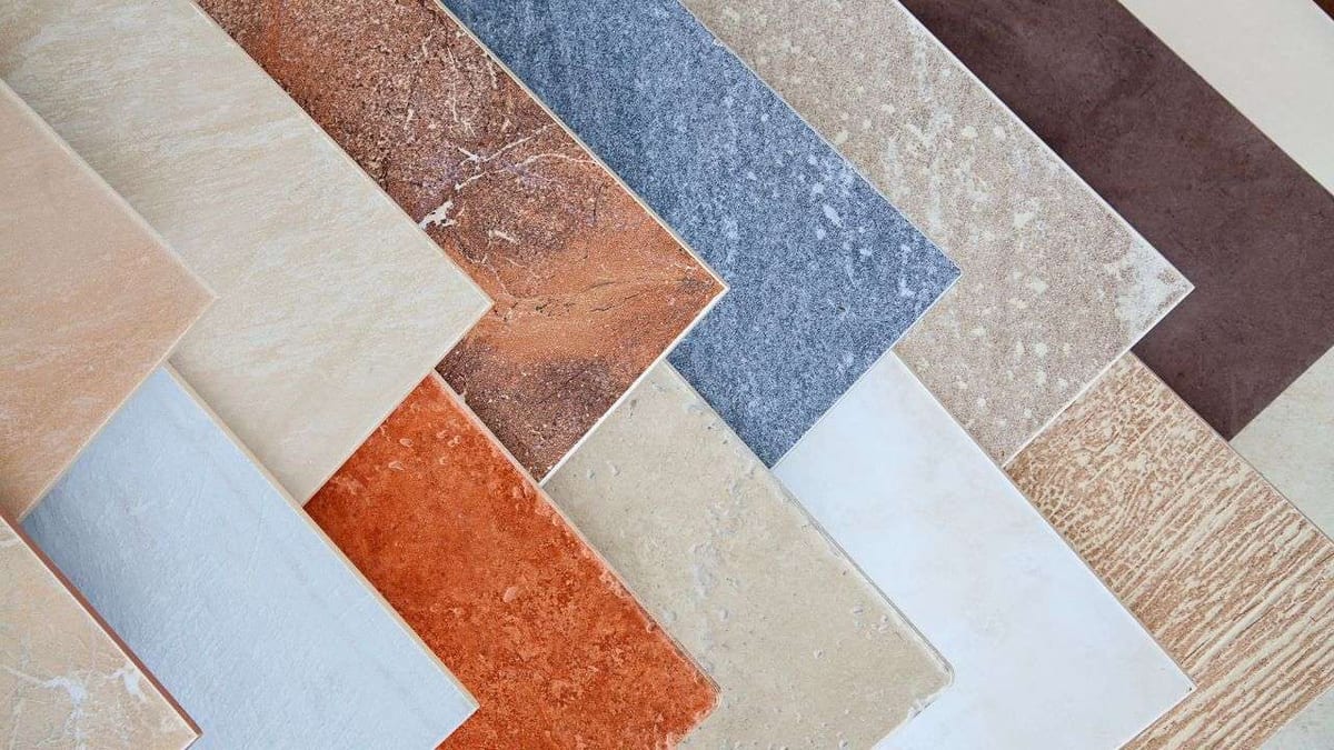 Fanned-out tile samples in beige, terracotta, blue-grey and brown.