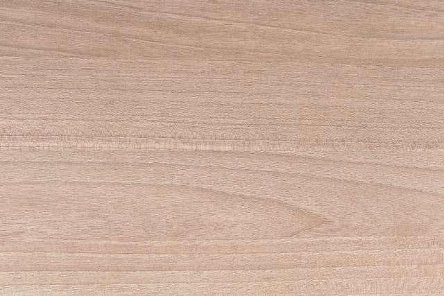 Close-up of a pale wood grain surface.