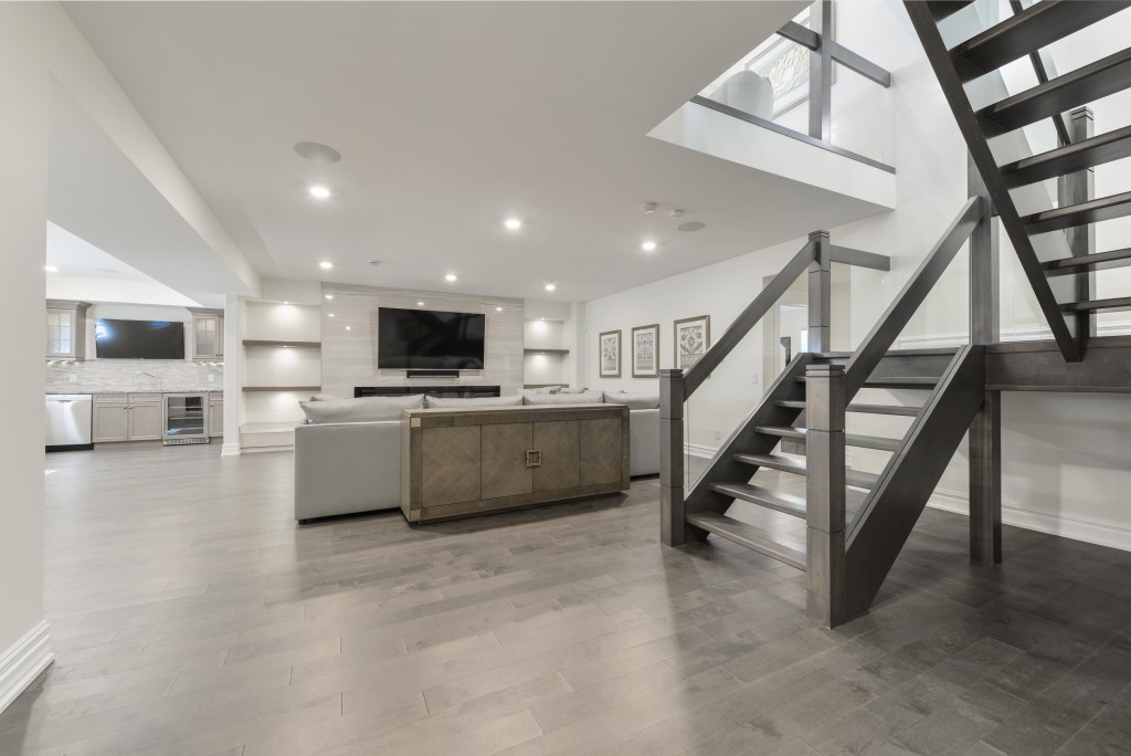 Luxury home with vinyl flooring installed in basement
